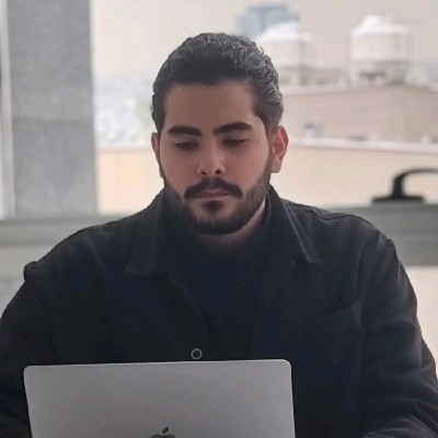 Mahdi Soghi working at a laptop
